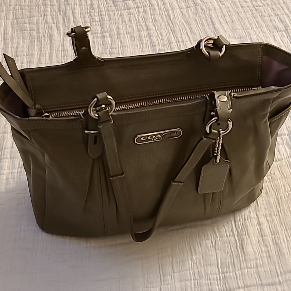 Coach taupe handbag with lavender interior accent